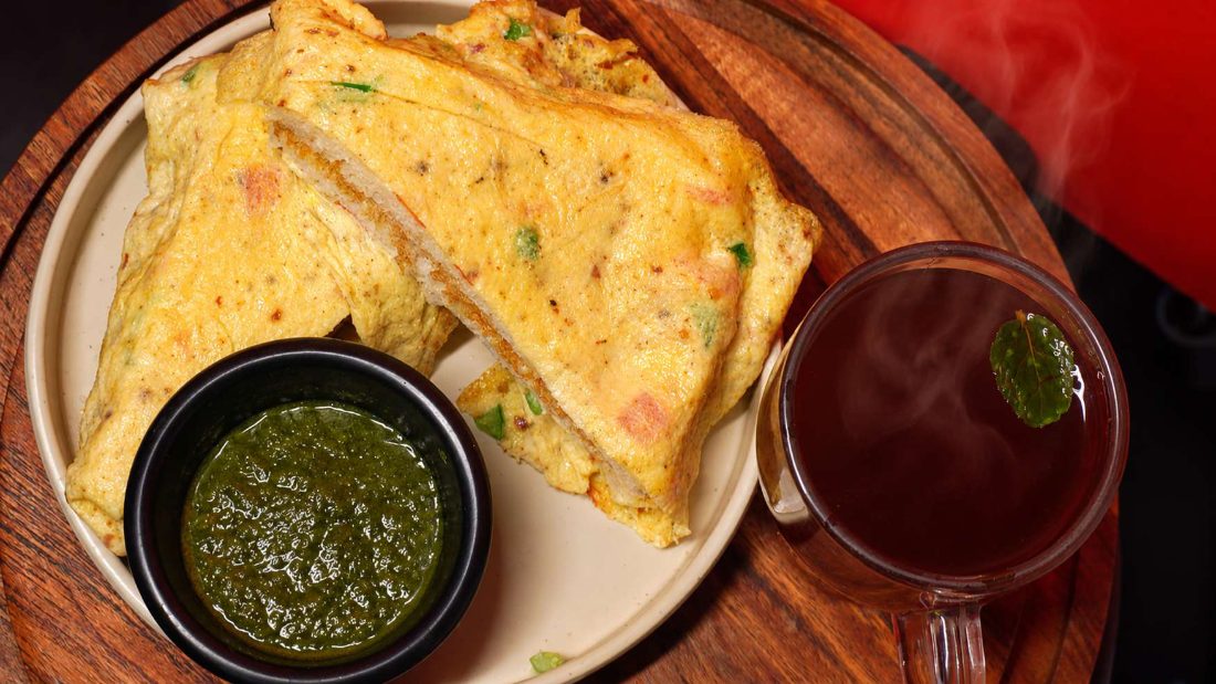 Omelette sandwich with chutney and tea